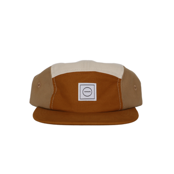 A five-panel cotton hat in shades of beige and a light brown color, with a logo on the front panel.