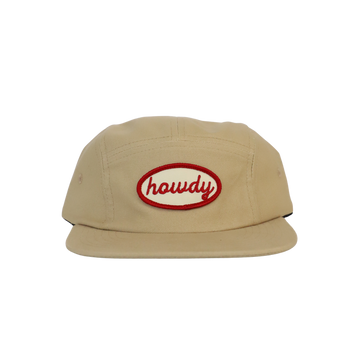 A beige five-panel cotton hat with the text 'howdy' embroidered on the front panel, designed for kids.
