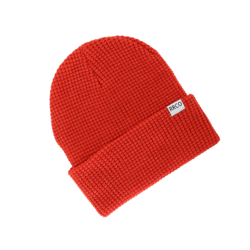 A red waffle knit beanie with a fold-over cuff, displayed on a neutral background.