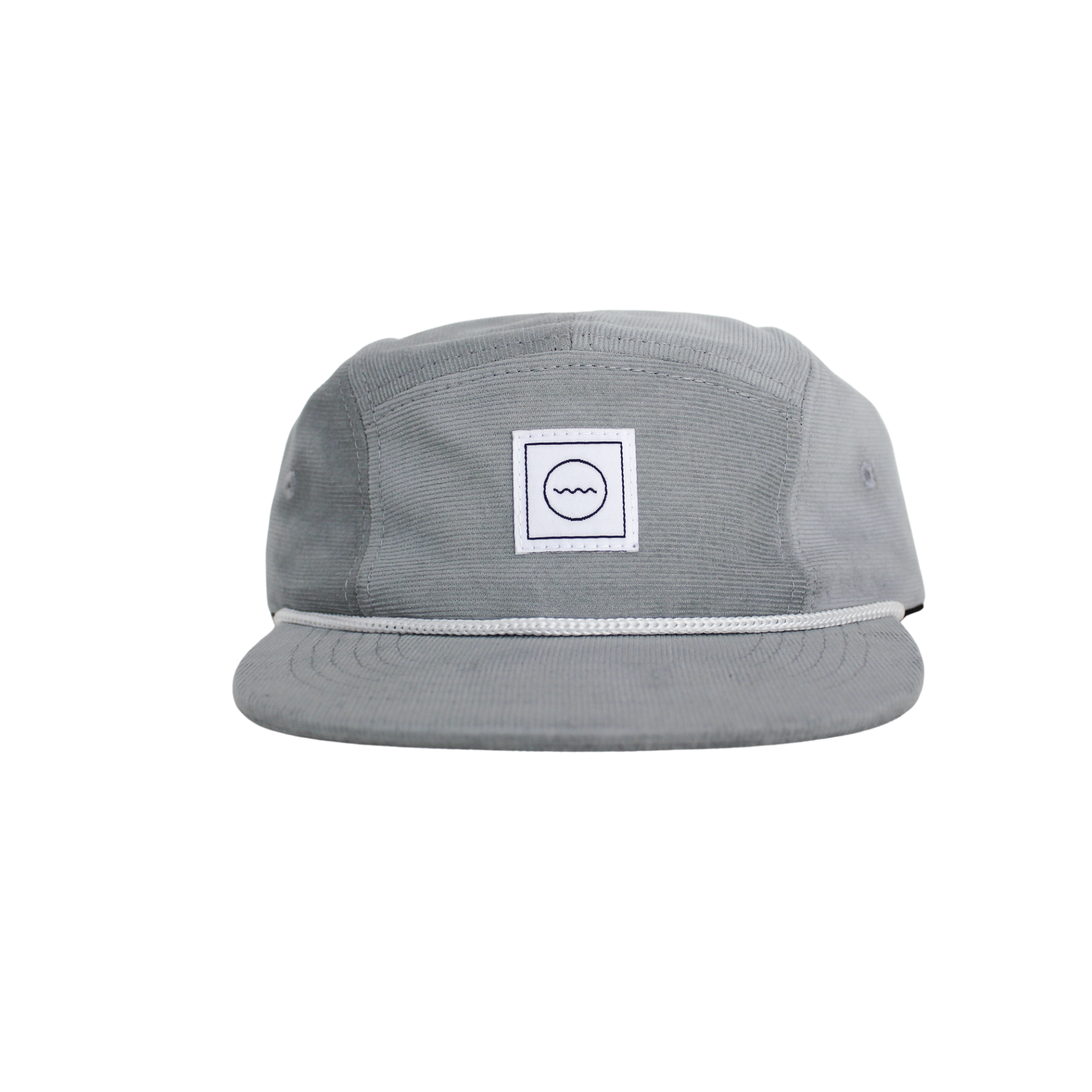 A gray corduroy five-panel hat with a white rope detail around the crown and a velcro back, featuring a white square logo with a symbol in the center.