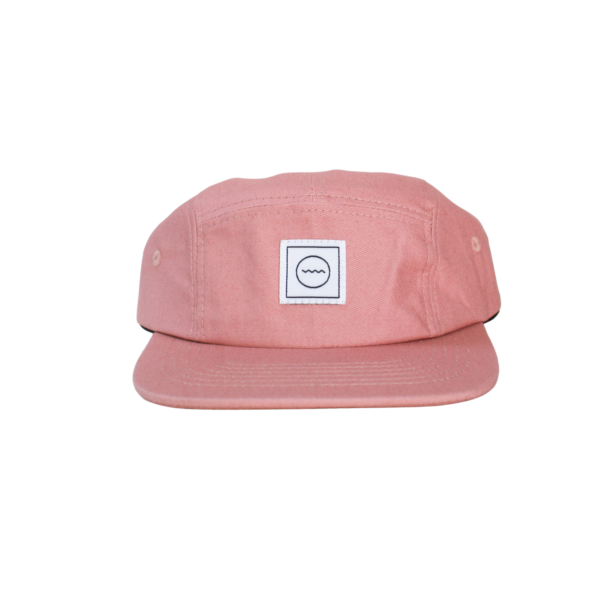 A blush pink five-panel cotton hat with an adjustable velcro back and fabric eyelets, suitable for kids.