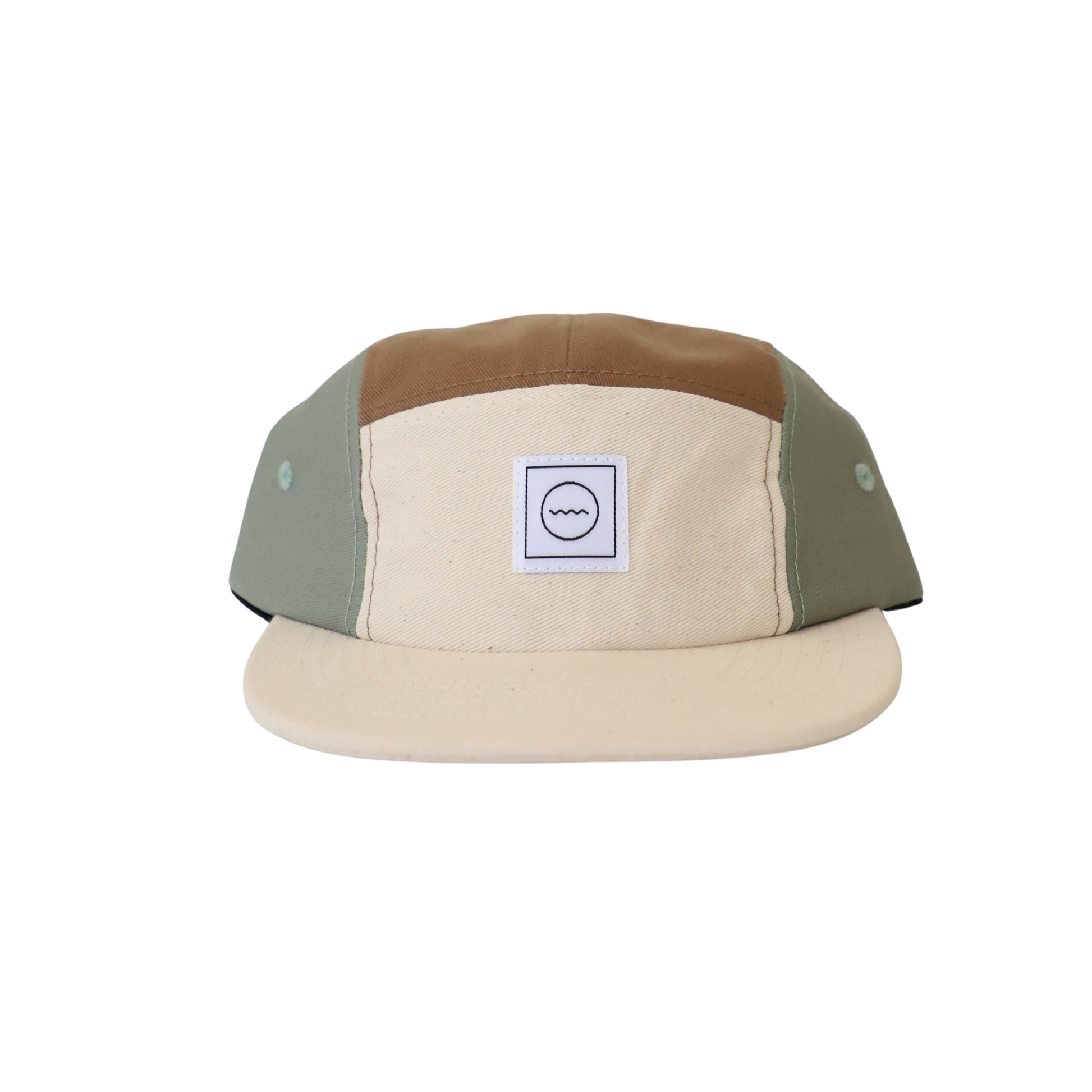 A beige and green cotton five-panel hat with an adjustable velcro back and fabric eyelets on the side panels, designed for kids.
