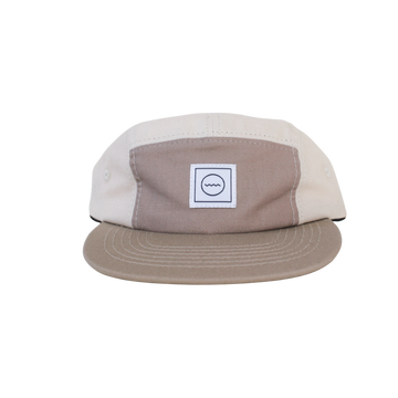 A beige and brown cotton five-panel kid's hat with an adjustable velcro back and fabric eyelets on the side.