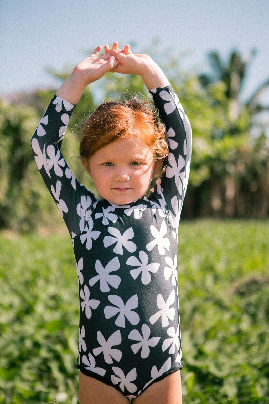 Girl's Long Sleeve Zip Up in Black Plumeria