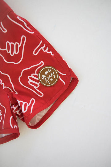 Kid’s Retro Boardshorts in Red Shaka